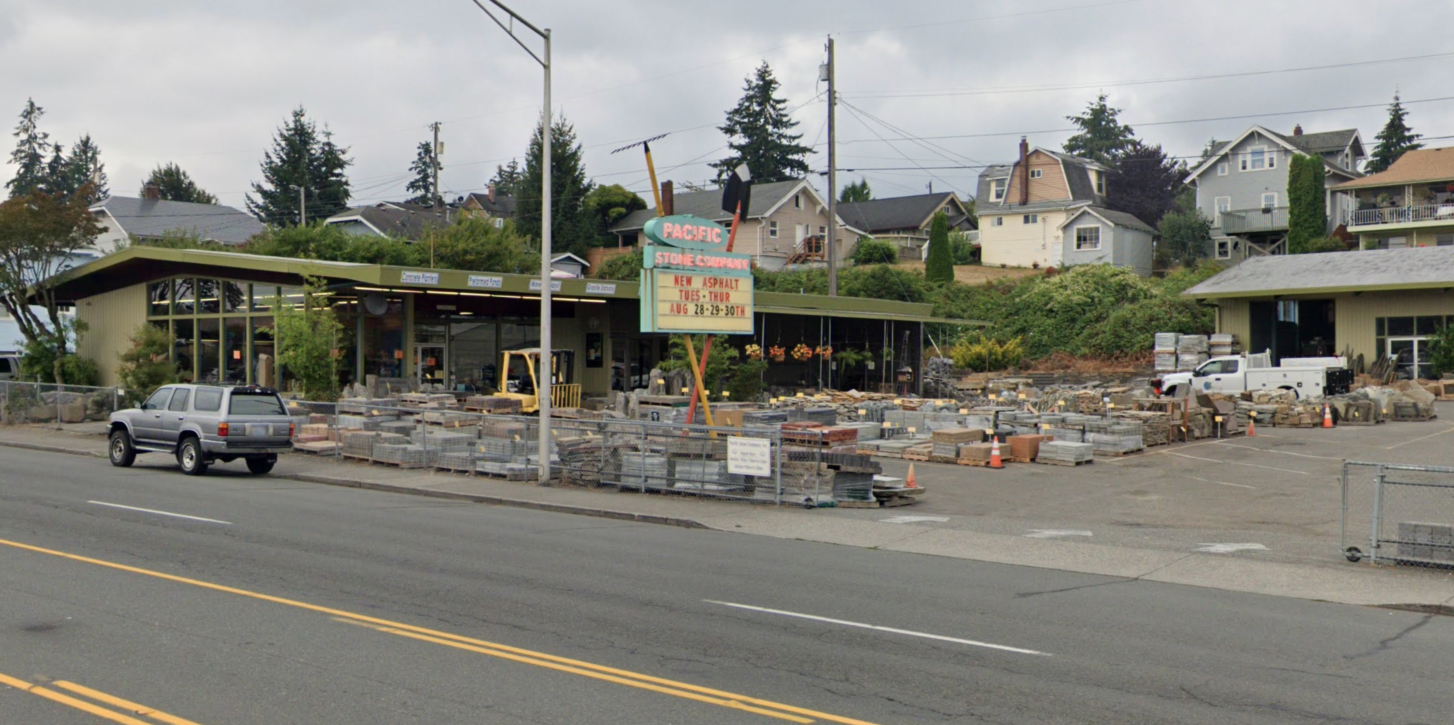 Google Maps photo of the Pacific Stone Company's iconic rake and shovel sign on Rucker Avenue in Everett, WA taken in August of 2021.